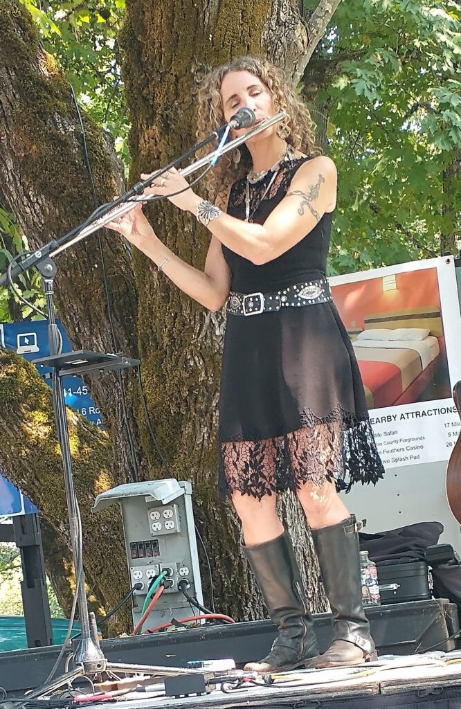 Jen playing flute at Pioneer Days, Canyonville, Oregon