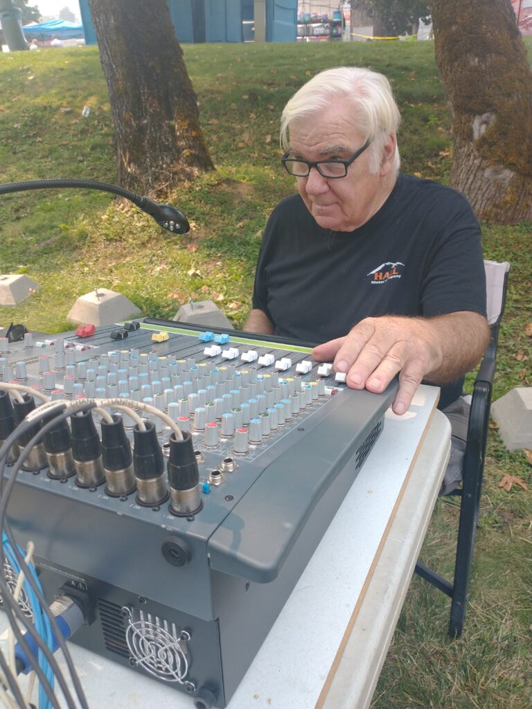 sound engineer, running main board at Lumber Jack stage, Canyonville Pioneer Days, Canyonville, Oregon